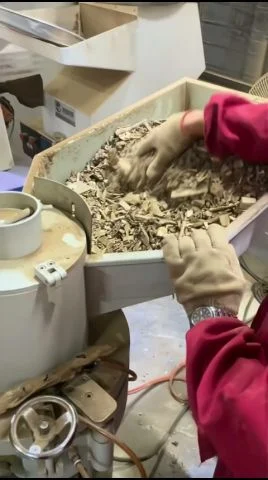 Agarwood chips being milled into graded powder at their origin